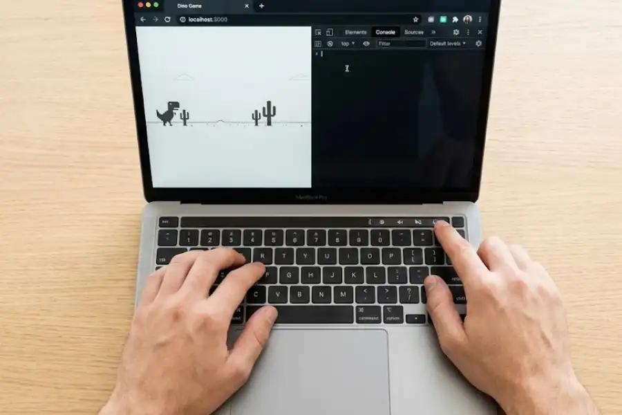 Google Chrome browser showing the developer console open with the Console tab selected next to the Dino Game